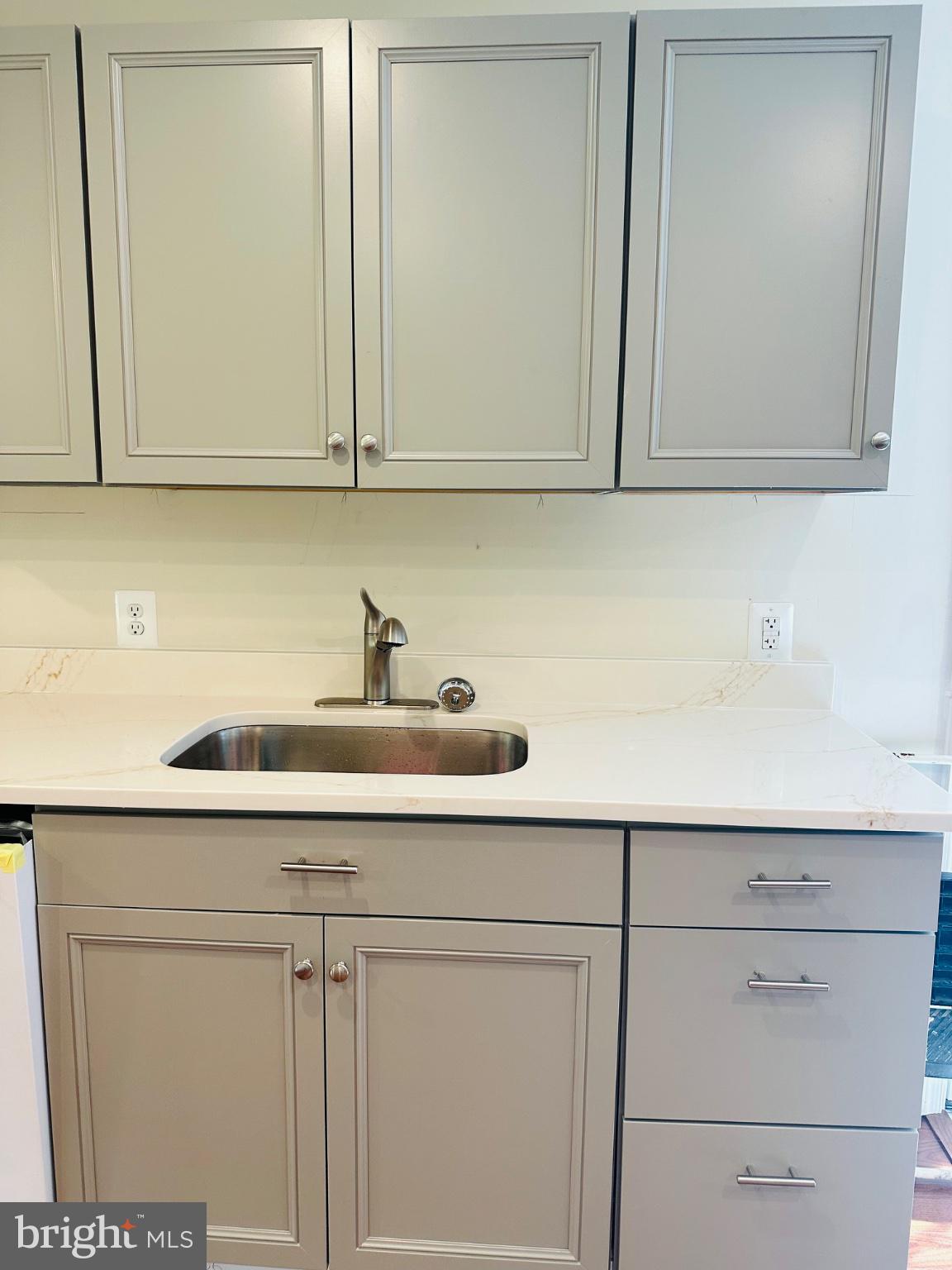 19754 Three Notch Road Lexington Park, MD 20653 - Photo 4 of 12 Sleek modern kitchen cabinetry design.