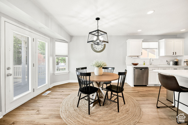 2280 South 450 West Perry, UT 84302 - Photo 10 of 38 Dining area with recessed lighting, light wood-type flooring, plenty of natural light, and a chandelier