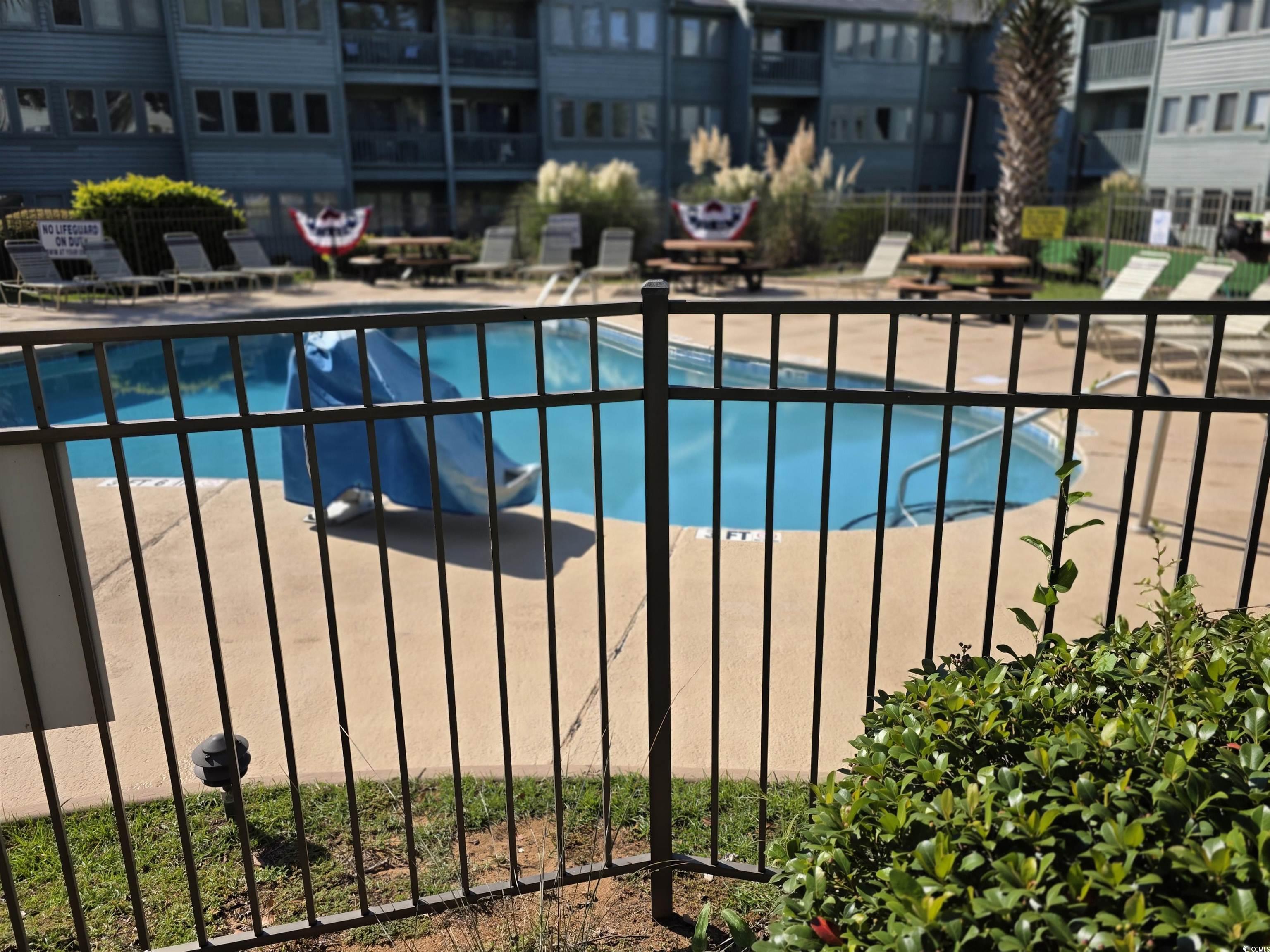 5905 Highway 17 South, Unit 6105 Myrtle Beach, SC 29575 - Photo 14 of 25 Community pool featuring a patio
