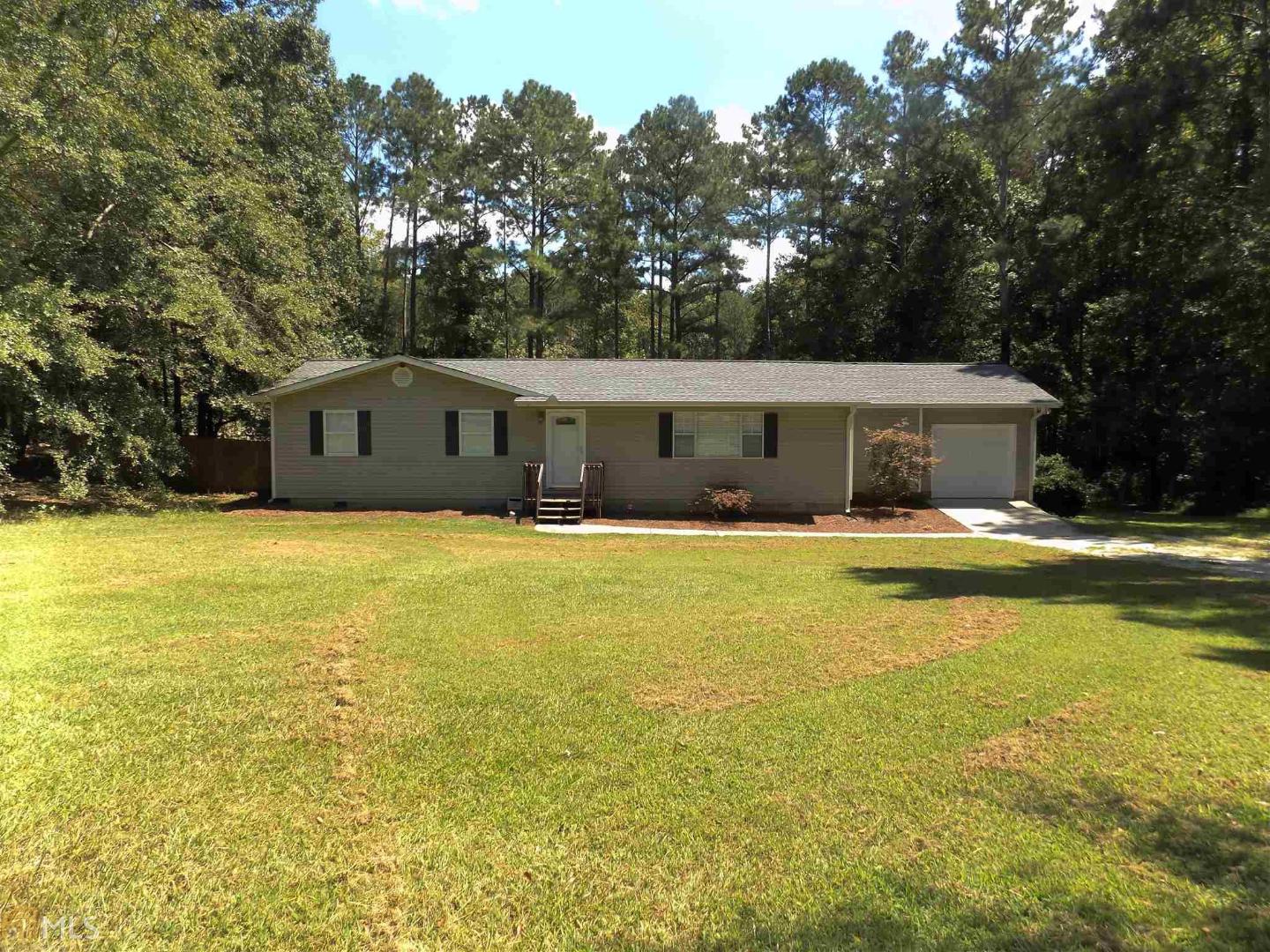808 Old Antioch Road Carrollton, GA 30117 - Photo 1 of 1 a view of house with swimming pool and trees in the background