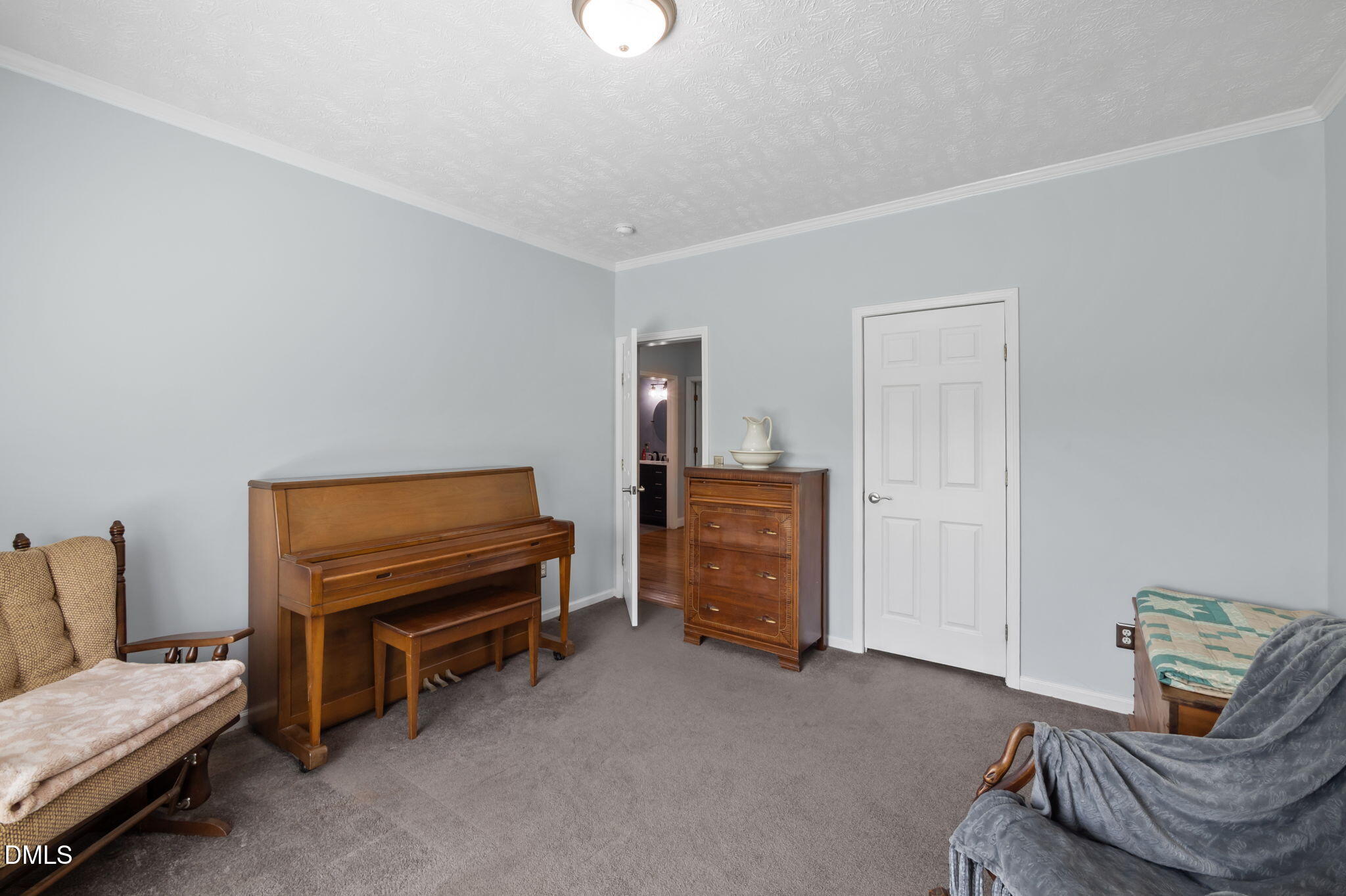 236 Dirgie Mine Road Roxboro, NC 27574 - Photo 37 of 55 a living room with furniture and a piano