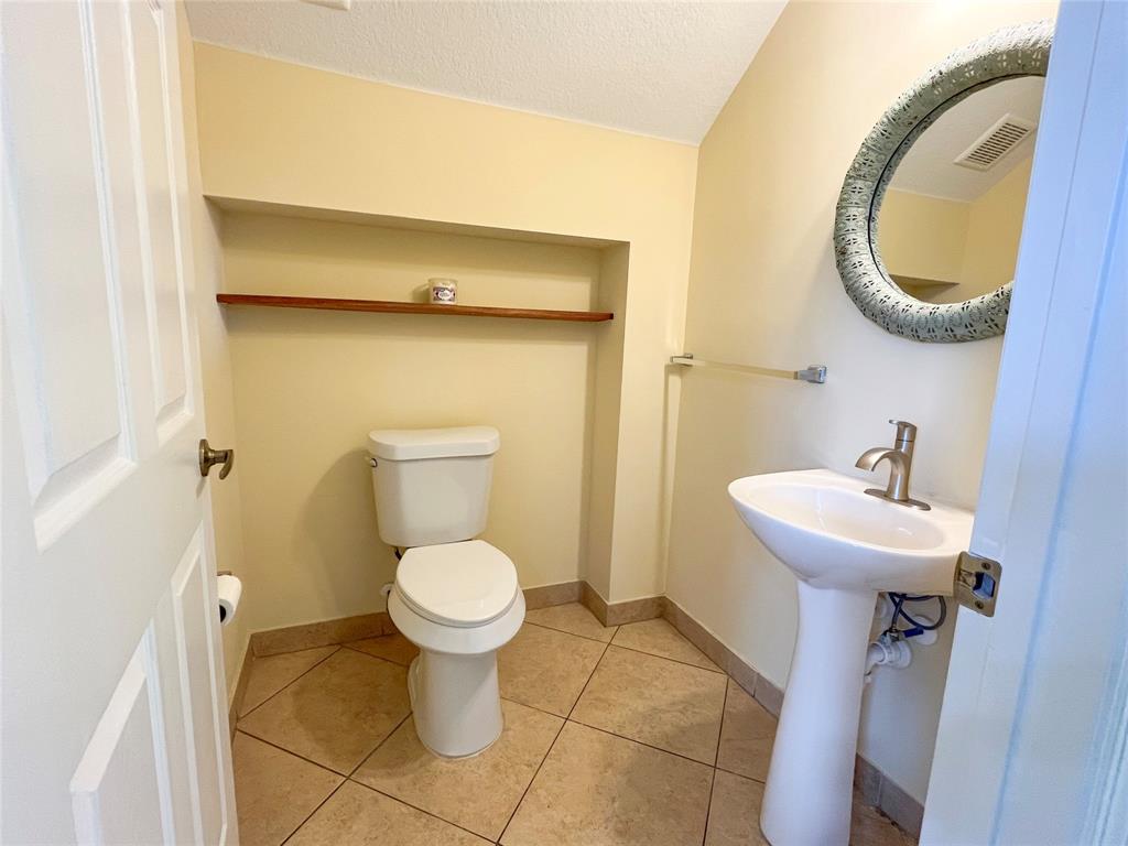 291 Lake Monterey Circle Boynton Beach, FL 33426 - Photo 16 of 47 a bathroom with a sink and a toilet