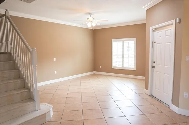 a view of entryway and hall with a front door