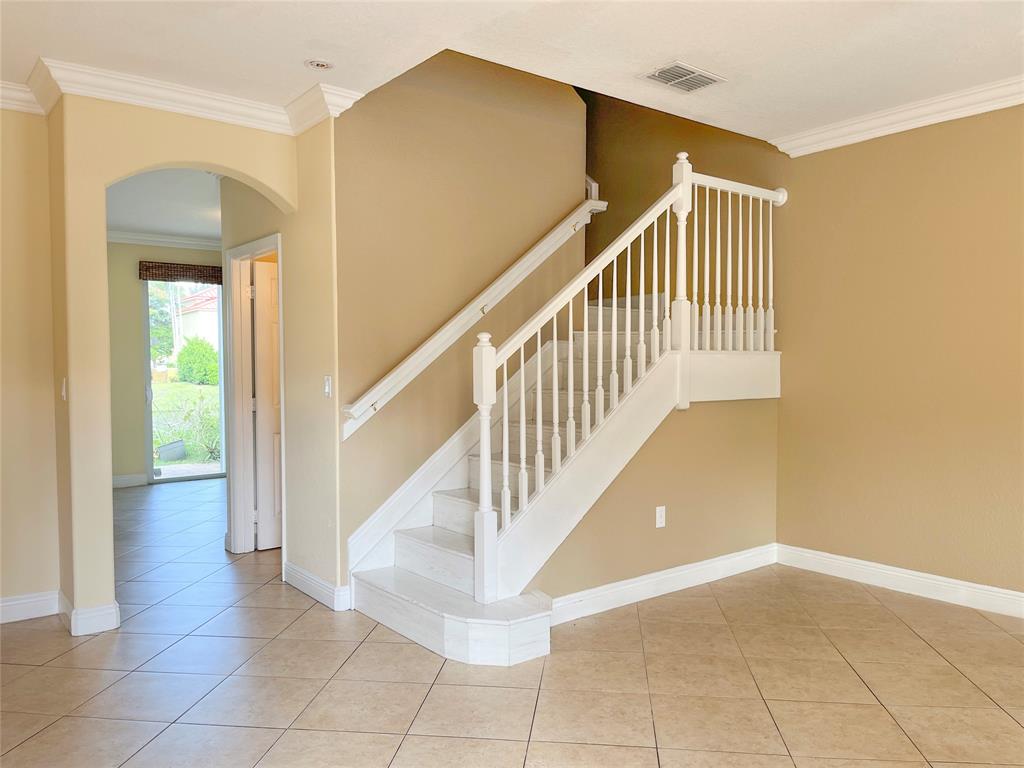 291 Lake Monterey Circle Boynton Beach, FL 33426 - Photo 18 of 47 a view of entryway and hall with a front door