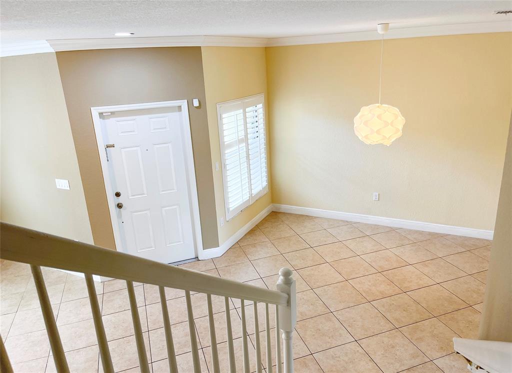 291 Lake Monterey Circle Boynton Beach, FL 33426 - Photo 19 of 47 a view of a livingroom with wooden floor and a window