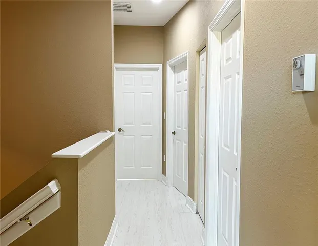 a view of a bathroom from a hallway