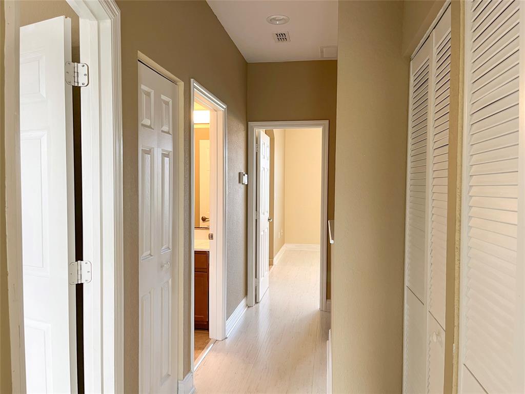291 Lake Monterey Circle Boynton Beach, FL 33426 - Photo 21 of 47 a view of a bathroom from a hallway