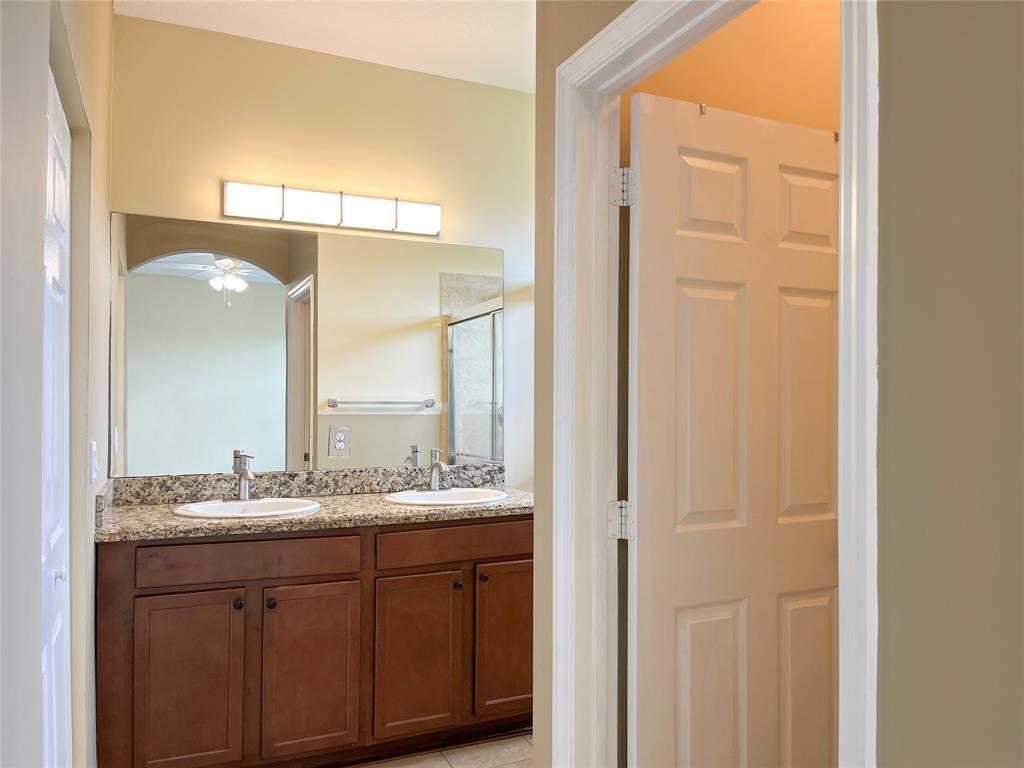 291 Lake Monterey Circle Boynton Beach, FL 33426 - Photo 26 of 47 a bathroom with a granite countertop sink and a mirror