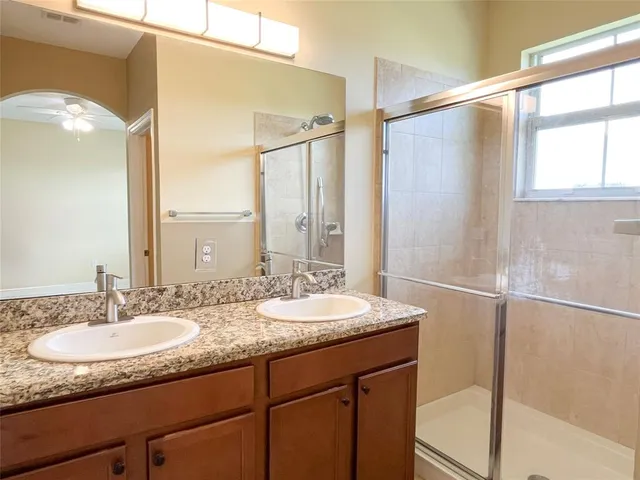 a white toilet sitting next to a small sink