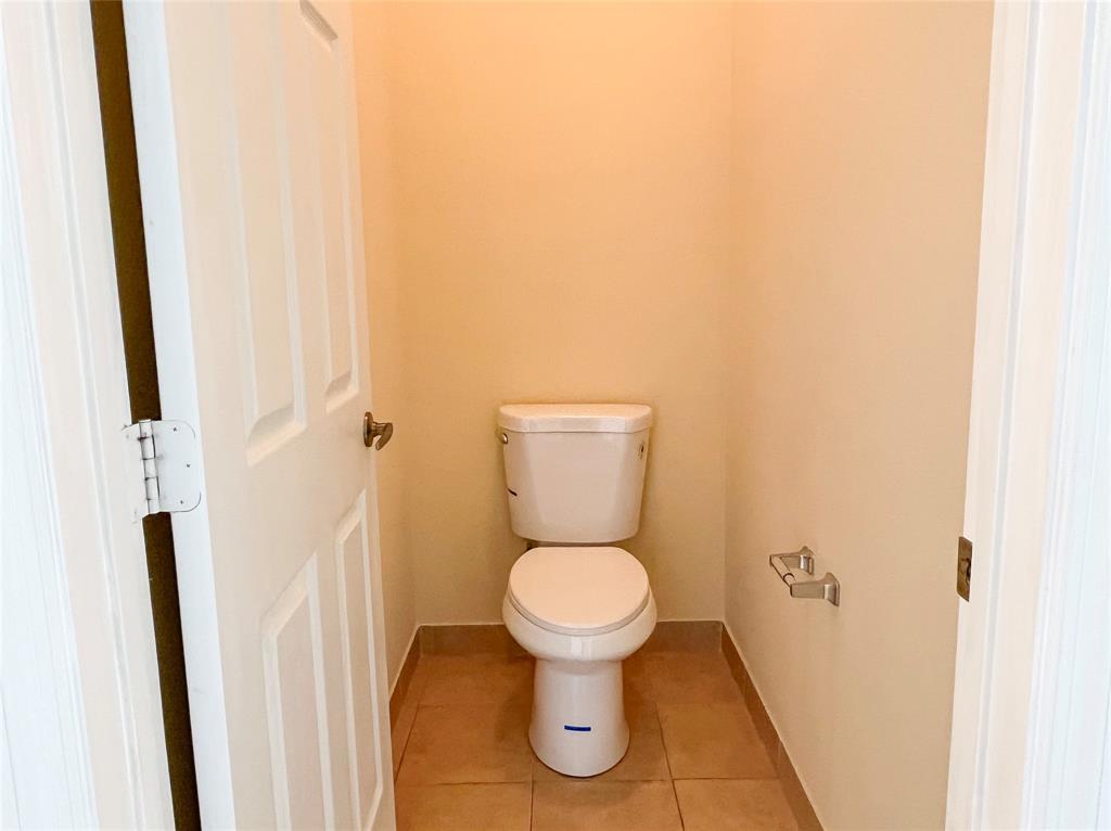 291 Lake Monterey Circle Boynton Beach, FL 33426 - Photo 28 of 47 a white toilet sitting next to a small sink