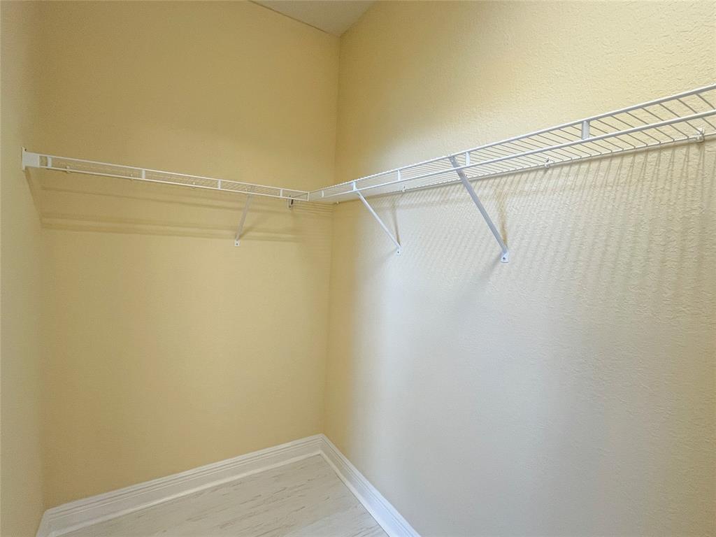 291 Lake Monterey Circle Boynton Beach, FL 33426 - Photo 31 of 47 a view of a room with racks on the wall