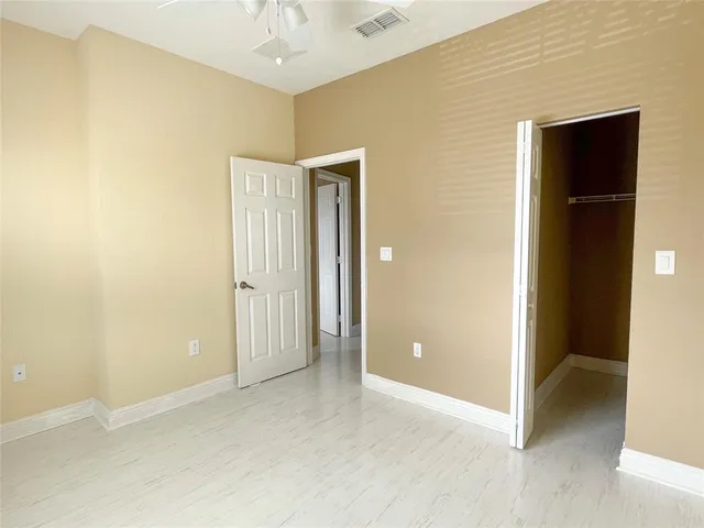 an empty room with a empty space and a window