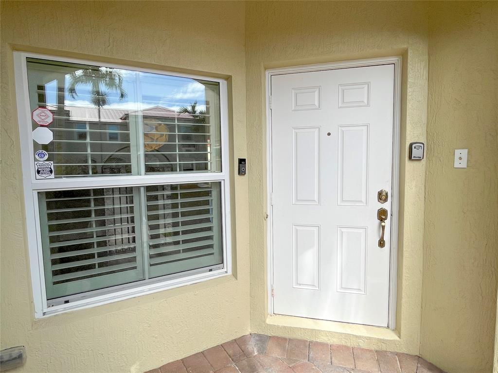 291 Lake Monterey Circle Boynton Beach, FL 33426 - Photo 4 of 47 a view of a door and a window