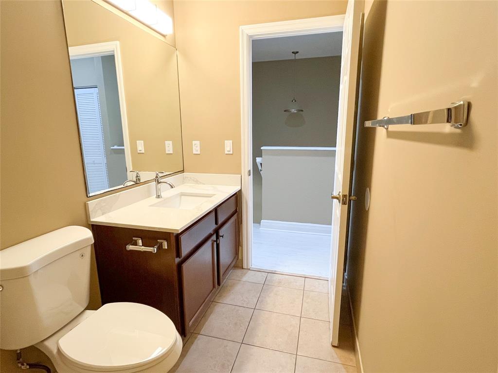 291 Lake Monterey Circle Boynton Beach, FL 33426 - Photo 43 of 47 a bathroom with a sink vanity mirror and toilet