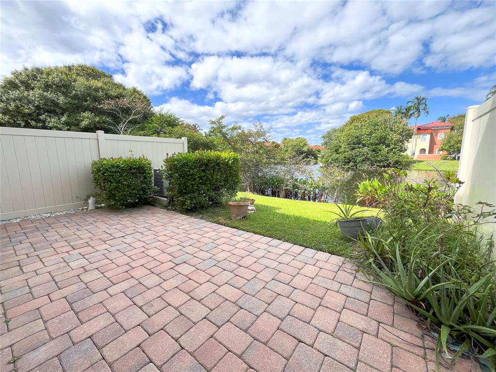291 Lake Monterey Circle Boynton Beach, FL 33426 - Photo 45 of 47 a view of a backyard