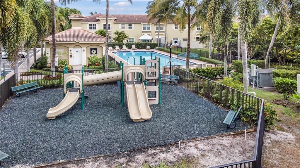 291 Lake Monterey Circle Boynton Beach, FL 33426 - Photo 46 of 47 a view of a table and chairs in patio