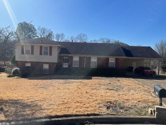 3025 Dumbarton Road Memphis, TN 38128 - Photo 1 of 22 a front view of a house with a yard covered with snow