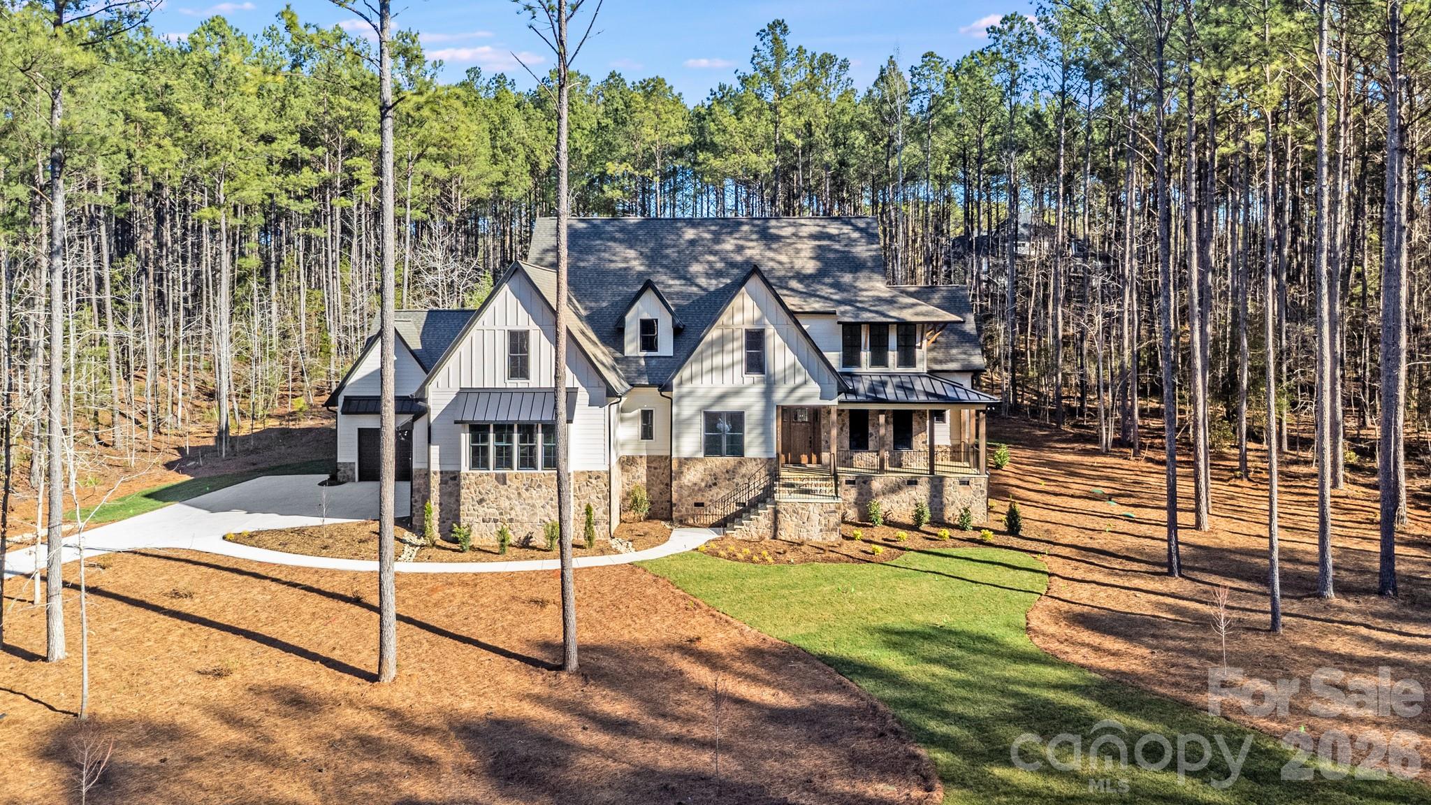 a view of a house with wooden fence