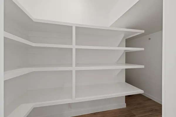 a view of a room with shelf on the wall