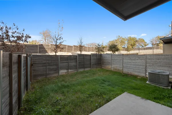 a view of a backyard of the house