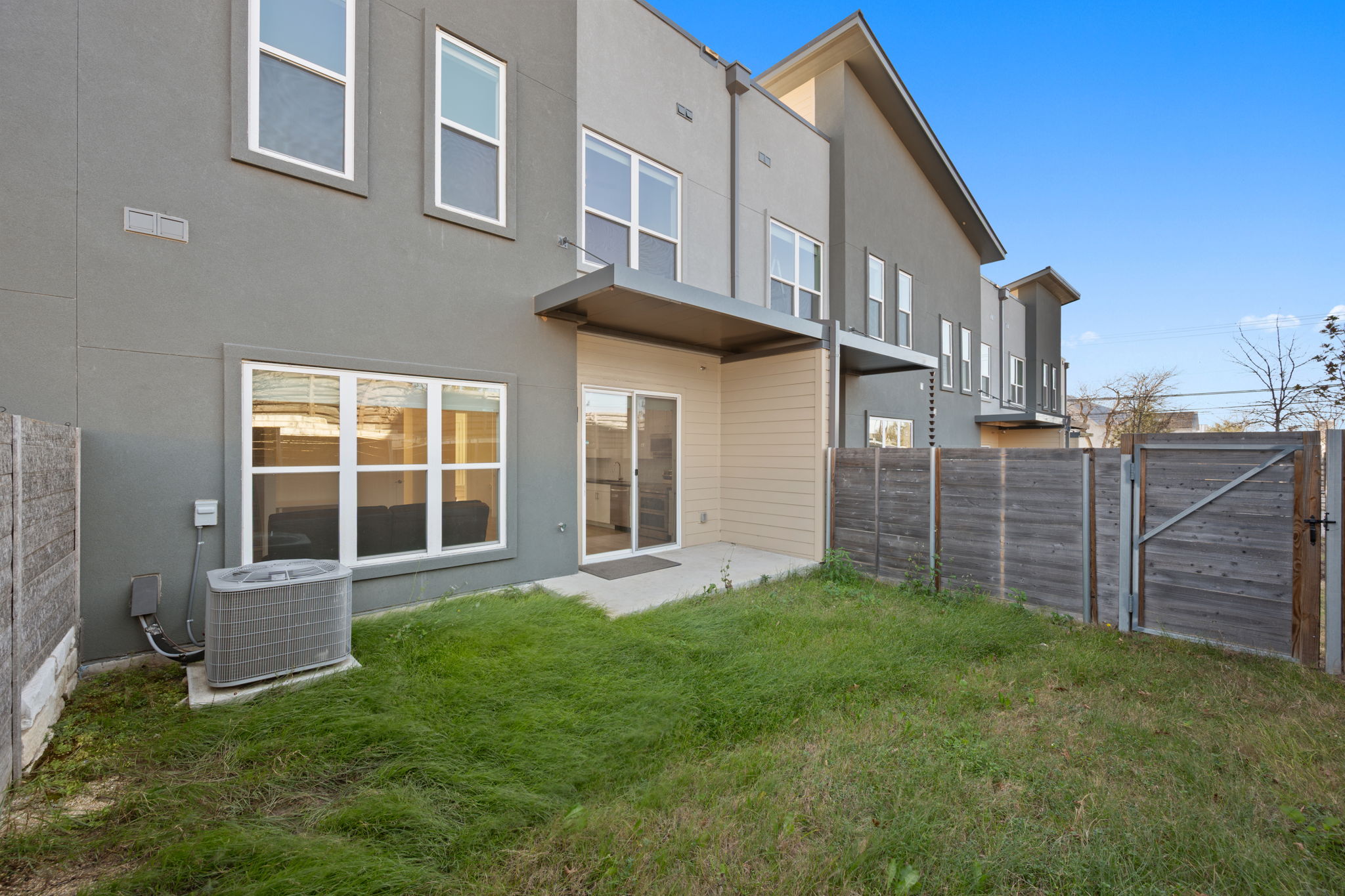 4901 Springdale Road, Unit 106 Austin, TX 78723 - Photo 31 of 40 a front view of a house with a yard