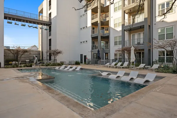 a view of pool with building exterior