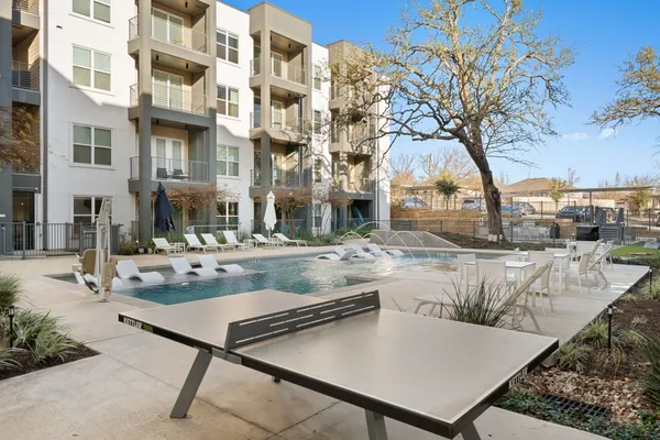 a view of a patio with couches and table with chairs