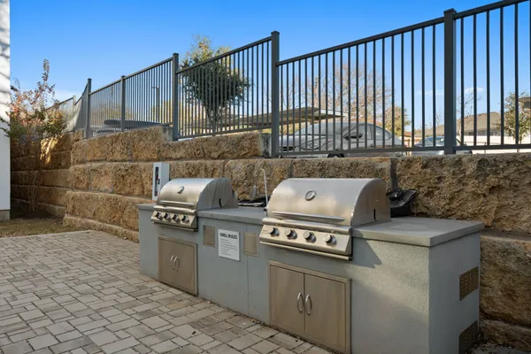 a stove top oven sitting inside of a kitchen