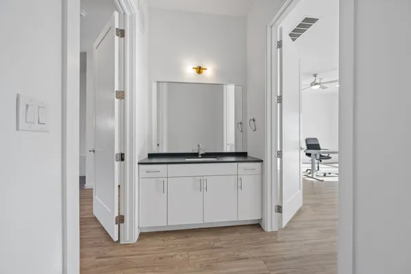 an empty room with wooden floor