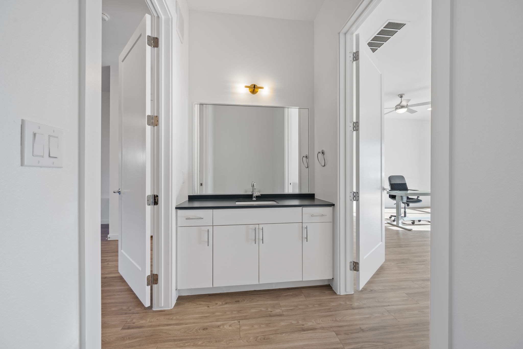 4901 Springdale Road, Unit 106 Austin, TX 78723 - Photo 8 of 40 an empty room with wooden floor