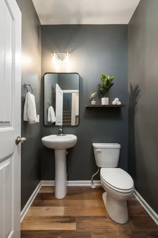 a bedroom with a bed and a night stand