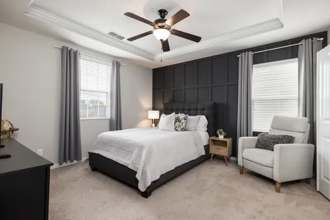 a view of a swimming pool and trees in the background