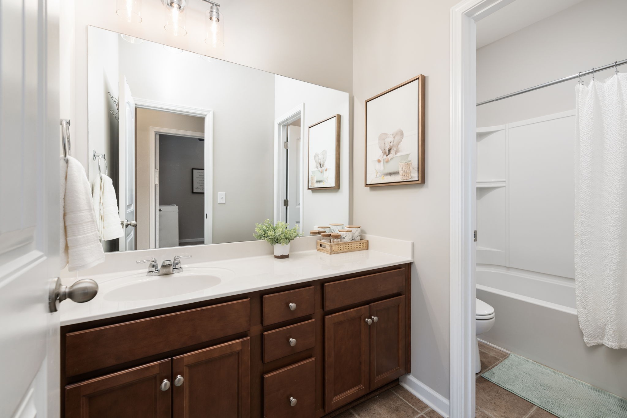 3760 Hoggett Ford Road Hermitage, TN 37076 - Photo 33 of 49 a bathroom with a sink a mirror and a shower