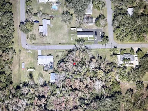 an aerial view of residential house with outdoor space