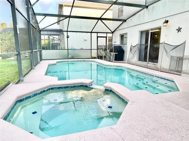 a view of a swimming pool with a patio
