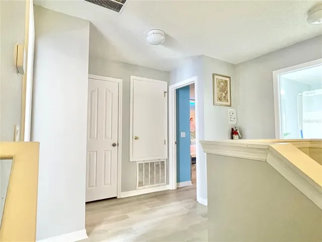 a living room with stainless steel appliances furniture and a window