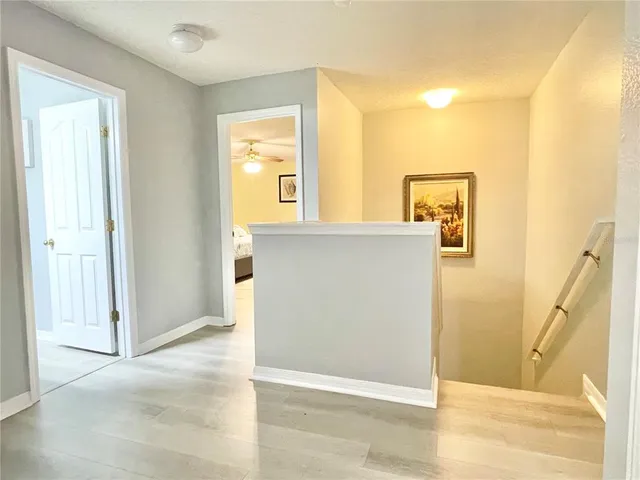 a view of a bathroom from a hallway