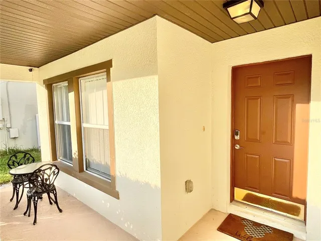 a view of a room that has a bed and a window