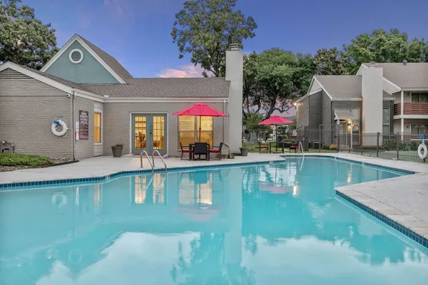 a view of a swimming pool with a patio