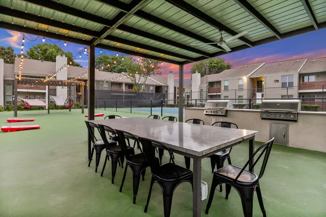 a dining table and chairs in a patio