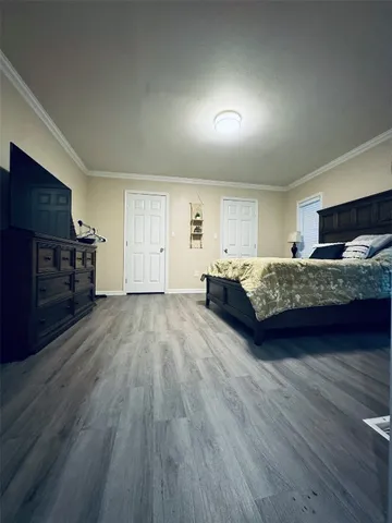 a view of a livingroom with furniture and a kitchen