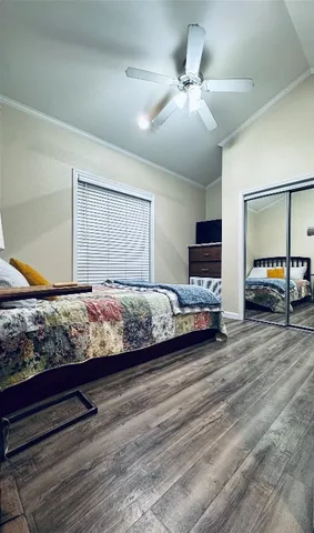 a bedroom with bed and window