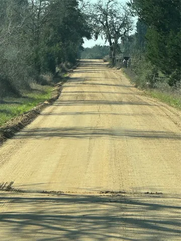 a view of a backyard of the house
