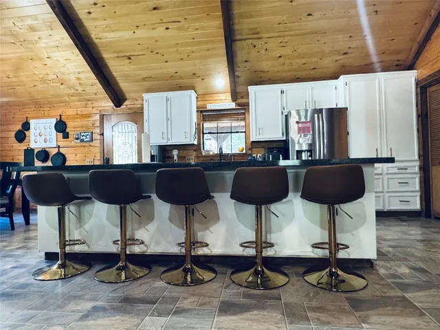 a bathroom with a shower and a sink