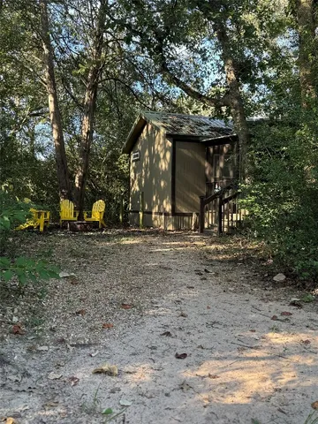 a bathroom with a sink a toilet a mirror and shower