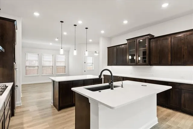 a kitchen with a sink and refrigerator