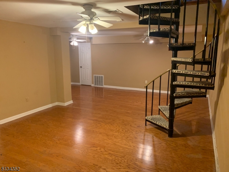33 Diamond Spring Road, Unit 1C Denville, NJ 07834 - Photo 6 of 8 a view of entryway and hall with wooden floor
