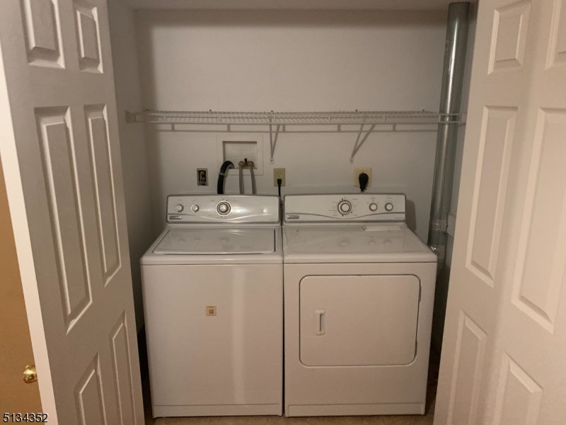 33 Diamond Spring Road, Unit 1C Denville, NJ 07834 - Photo 7 of 8 a utility room with dryer and washer