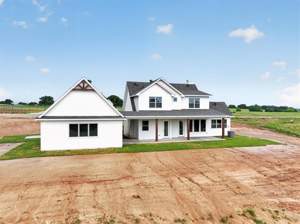 225 Kilkenny Road Poolville, TX 76487 - Photo 36 of 36 Modern farmhouse exterior featuring white siding and a dark shingle roof