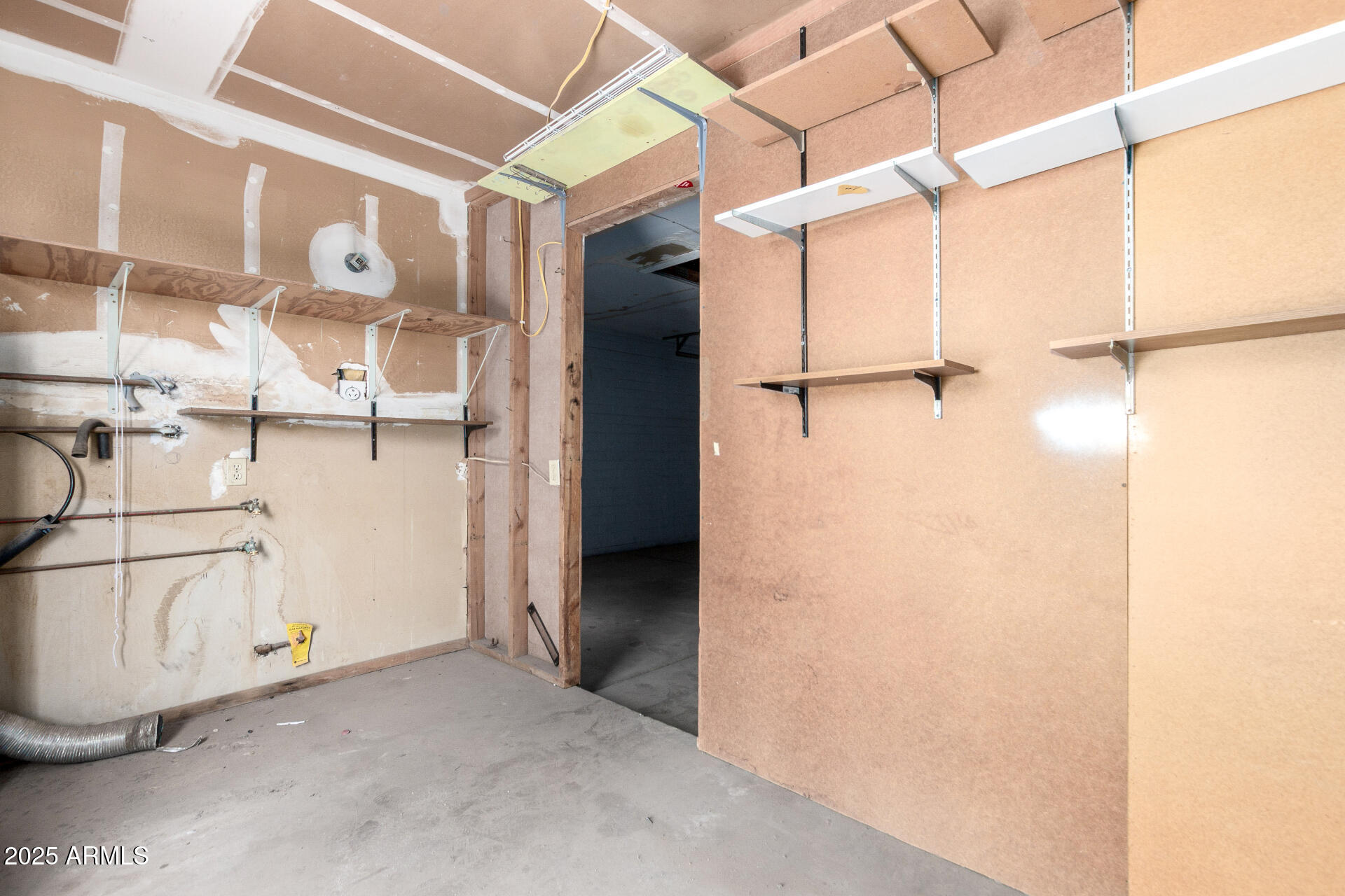4740 West Bloomfield Road Glendale, AZ 85304 - Photo 28 of 34 a view of a room with racks on the wall